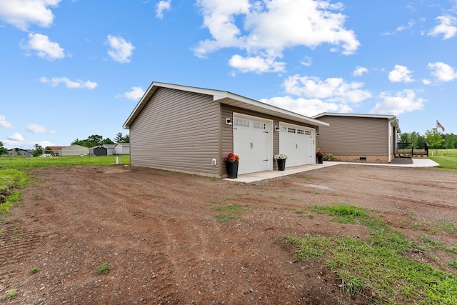 16536 Hook Cir, Pokegama Twp, MN 55030 - view of side of home with a garage, crawl space, and an outdoor structure