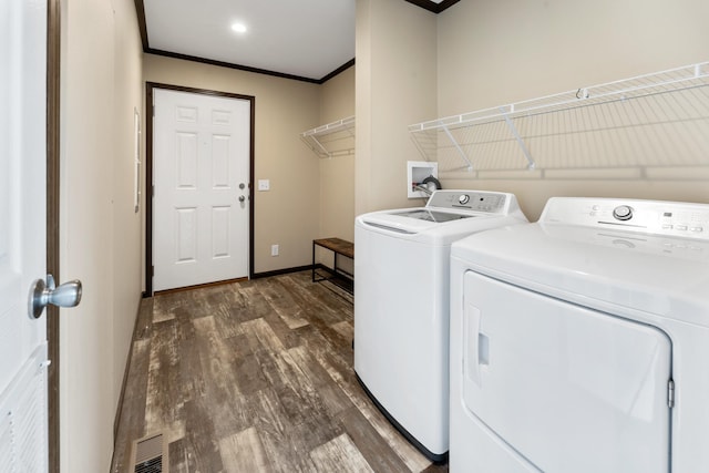 16536 Hook Cir, Pokegama Twp, MN 55030 - laundry room featuring washer and dryer, dark wood finished floors, and ornamental molding