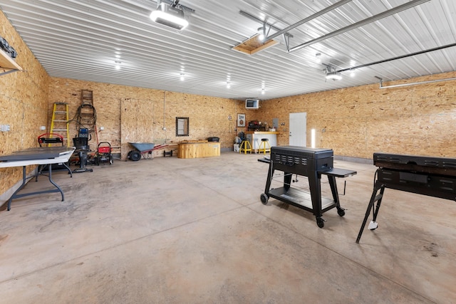 16536 Hook Cir, Pokegama Twp, MN 55030 - garage featuring a workshop area and a garage door opener