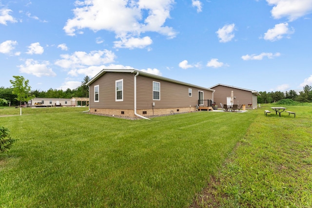16536 Hook Cir, Pokegama Twp, MN 55030 - back of house with crawl space and a lawn