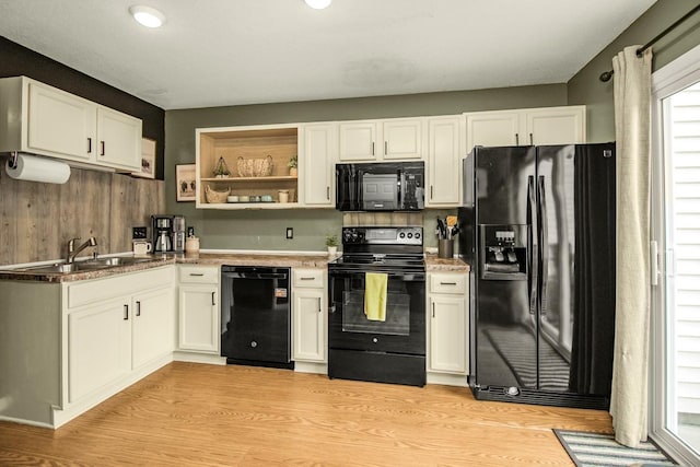 1146 100th Dr NE Unit A, Blaine, MN 55434 - kitchen with black appliances, light wood-type flooring, white cabinets, and open shelves