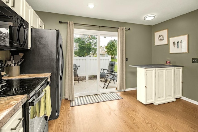 1146 100th Dr NE Unit A, Blaine, MN 55434 - kitchen with black appliances, light wood-style flooring, white cabinetry, and recessed lighting