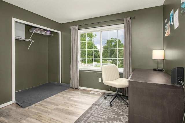 1146 100th Dr NE Unit A, Blaine, MN 55434 - office area featuring wood finished floors and baseboards