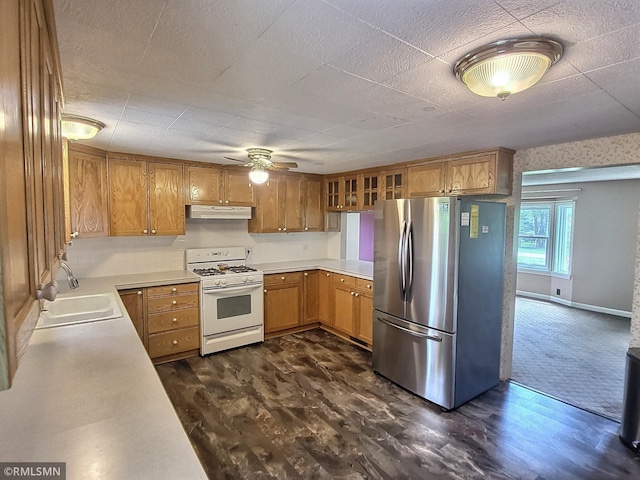 318 Alder Rd, Lynden Twp, MN 55382 - kitchen featuring white gas range oven, freestanding refrigerator, under cabinet range hood, a ceiling fan, and light countertops