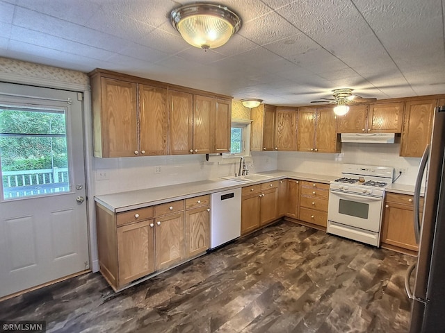 318 Alder Rd, Lynden Twp, MN 55382 - kitchen featuring white appliances, under cabinet range hood, ceiling fan, light countertops, and brown cabinets