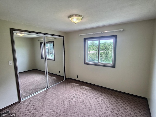 318 Alder Rd, Lynden Twp, MN 55382 - unfurnished bedroom featuring carpet floors and a closet