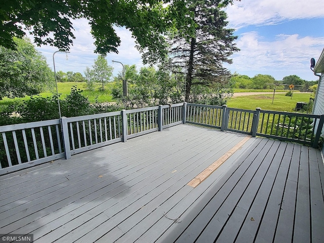 318 Alder Rd, Lynden Twp, MN 55382 - wooden deck featuring a yard
