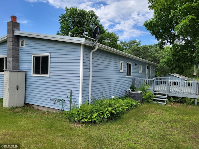 318 Alder Rd, Lynden Twp, MN 55382 - view of property exterior with a deck, a yard, and a chimney