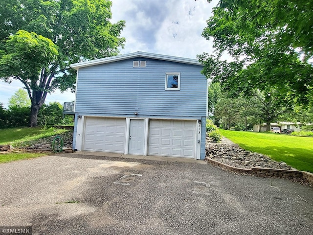 318 Alder Rd, Lynden Twp, MN 55382 - view of home's exterior featuring asphalt driveway, a yard, and an attached garage