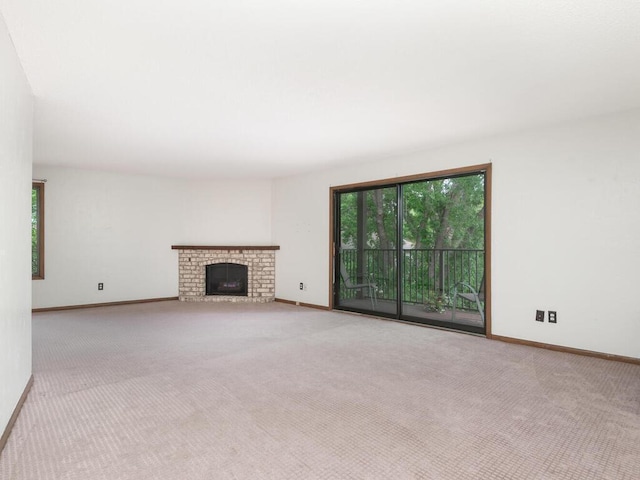 2200 Nevada Ave S Unit 206, Saint Louis Park, MN 55426 - unfurnished living room with carpet floors, baseboards, and a brick fireplace