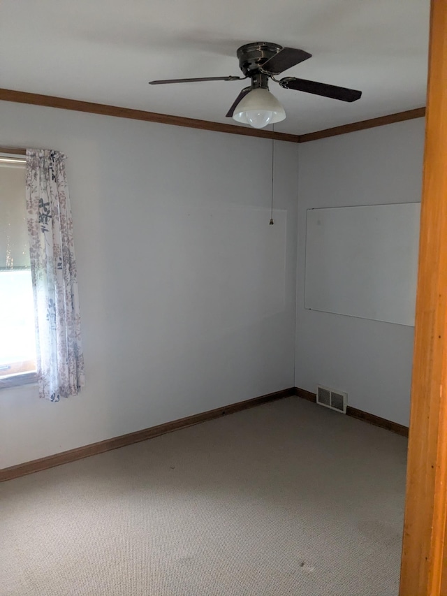 1193 County Road B E, Maplewood, MN 55109 - empty room featuring carpet flooring, ornamental molding, and a ceiling fan