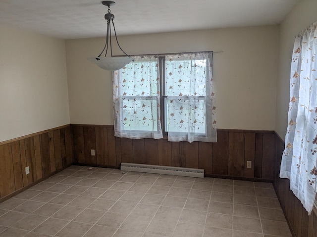 1193 County Road B E, Maplewood, MN 55109 - unfurnished dining area featuring a baseboard radiator, plenty of natural light, a wainscoted wall, wood walls, and light tile patterned floors