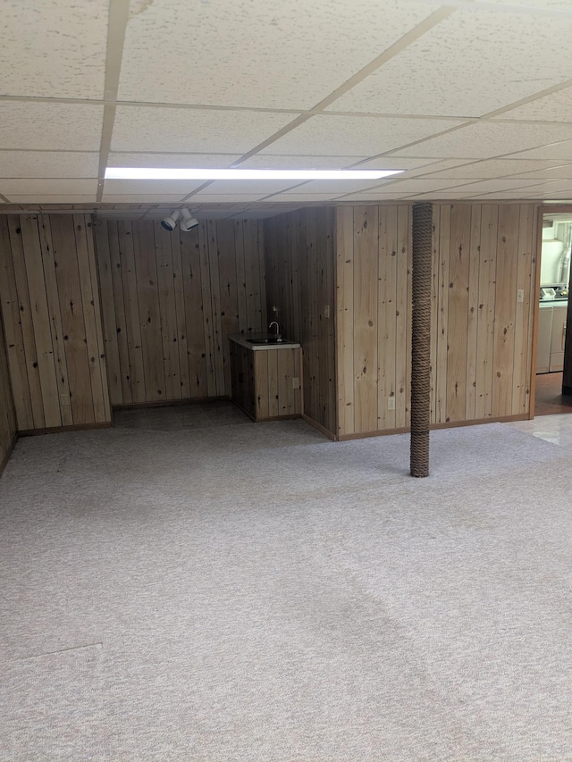 1193 County Road B E, Maplewood, MN 55109 - finished below grade area featuring a drop ceiling, light carpet, washer / clothes dryer, and wooden walls
