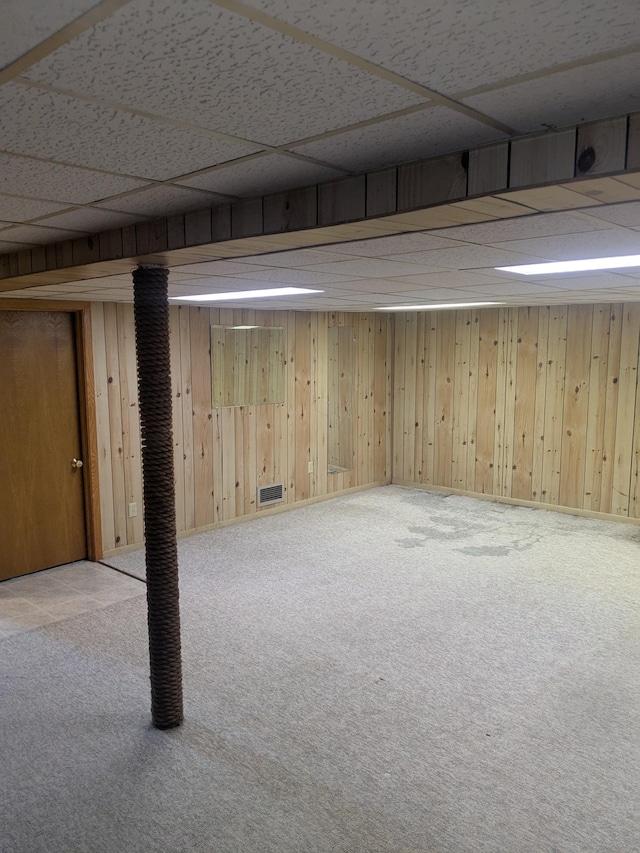 1193 County Road B E, Maplewood, MN 55109 - finished basement featuring a drop ceiling, carpet, and wooden walls