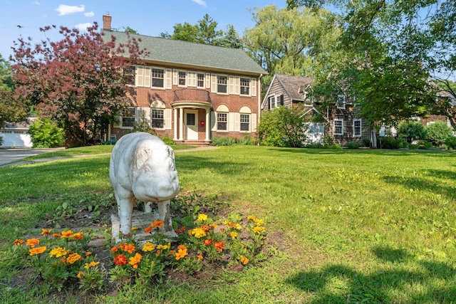 1913 River Pkwy, Minneapolis, MN 55414 - colonial inspired home with a front lawn and a chimney
