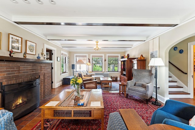 1913 River Pkwy, Minneapolis, MN 55414 - living area with a brick fireplace, beamed ceiling, a chandelier, stairway, and crown molding