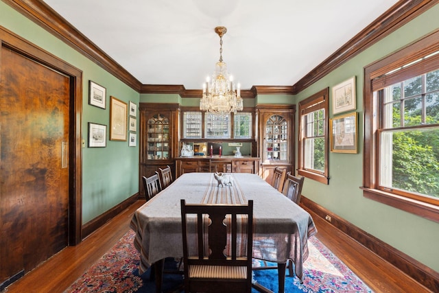 1913 River Pkwy, Minneapolis, MN 55414 - dining room with a chandelier, ornamental molding, and dark wood-style flooring