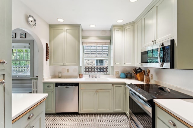 1913 River Pkwy, Minneapolis, MN 55414 - kitchen featuring stainless steel appliances, light countertops, and recessed lighting
