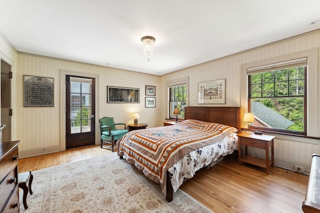 1913 River Pkwy, Minneapolis, MN 55414 - bedroom with light wood-style flooring and access to outside