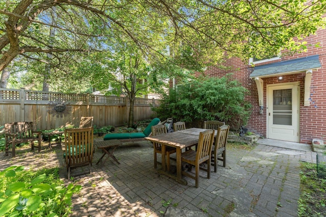 1913 River Pkwy, Minneapolis, MN 55414 - fenced backyard with a patio area and outdoor dining space