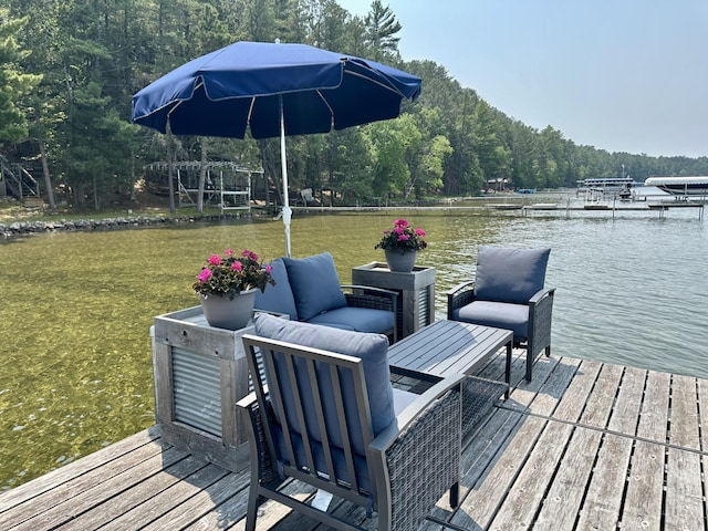12332 Manhattan Point Blvd, Crosslake, MN 56442 - dock area with a water view, a forest view, and an outdoor living space