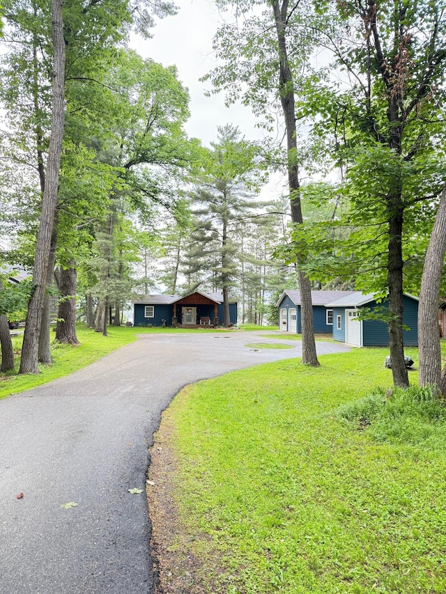12332 Manhattan Point Blvd, Crosslake, MN 56442 - view of front of home featuring asphalt driveway and a front yard
