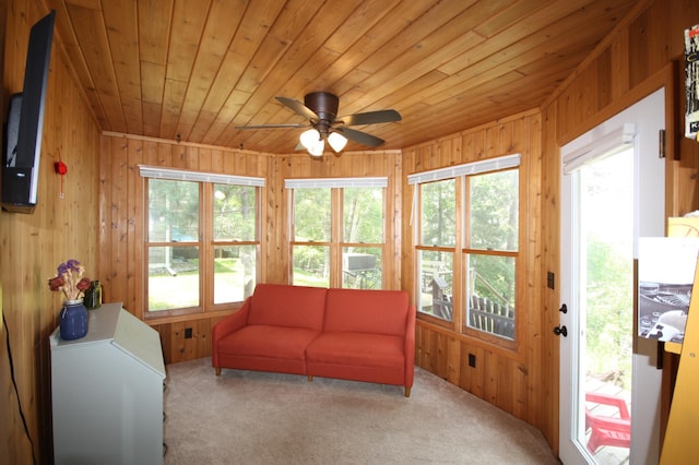 12332 Manhattan Point Blvd, Crosslake, MN 56442 - living room featuring carpet floors, wooden ceiling, wood walls, and ceiling fan