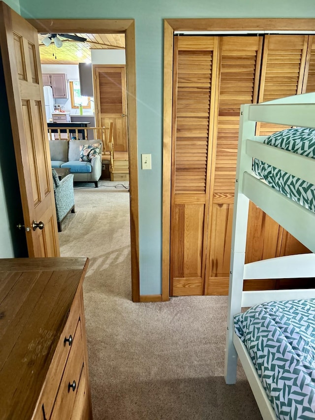 12332 Manhattan Point Blvd, Crosslake, MN 56442 - bedroom with carpet flooring, a closet, and freestanding refrigerator