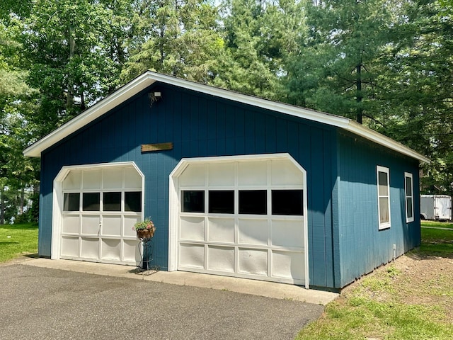 12332 Manhattan Point Blvd, Crosslake, MN 56442 - detached garage featuring view of wooded area