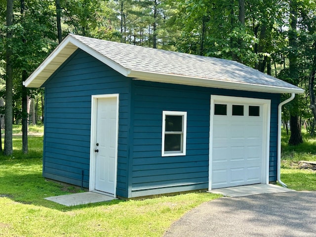 12332 Manhattan Point Blvd, Crosslake, MN 56442 - view of outbuilding with driveway and view of wooded area