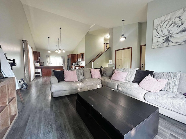 12383 Midway Cir NE, Blaine, MN 55449 - living room featuring dark wood-style floors and high vaulted ceiling