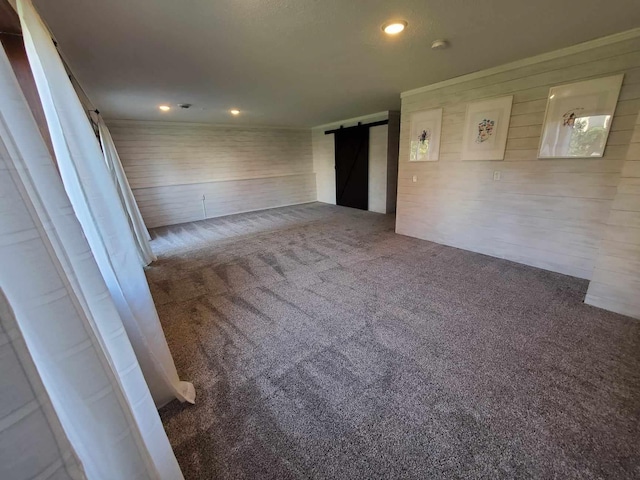 12383 Midway Cir NE, Blaine, MN 55449 - empty room featuring a barn door, carpet, recessed lighting, ornamental molding, and a smoke detector