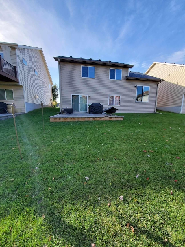 12383 Midway Cir NE, Blaine, MN 55449 - back of property featuring a lawn and a patio
