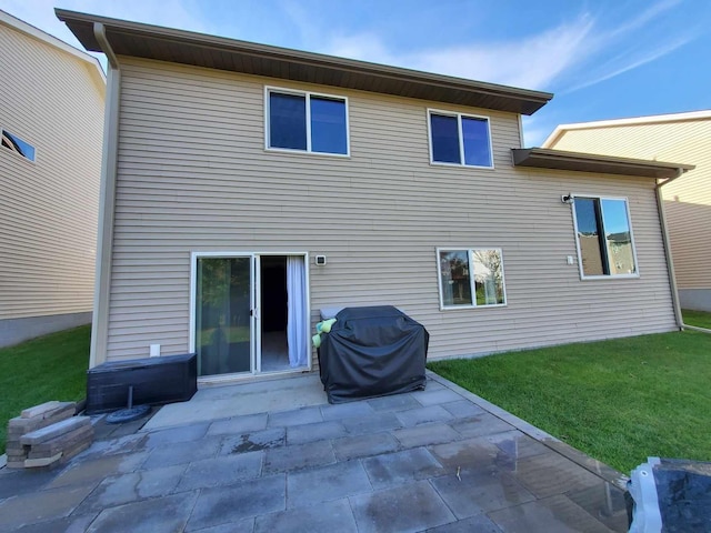 12383 Midway Cir NE, Blaine, MN 55449 - back of property featuring a patio and a yard