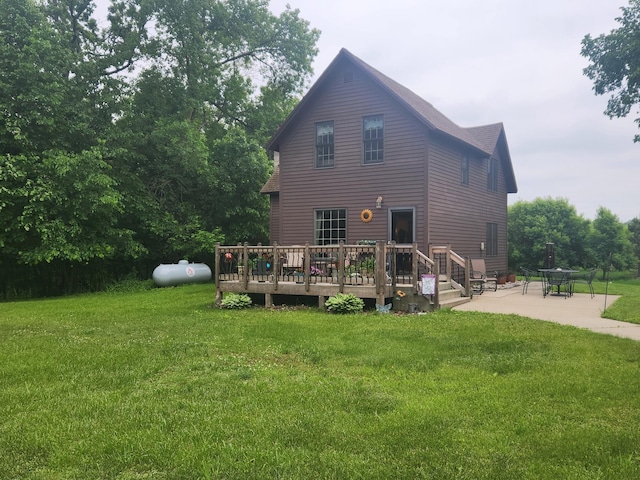 23064 Pearl Lake Rd, Lake View Twp, MN 56501 - back of house featuring a patio area, a deck, a lawn, and roof with shingles