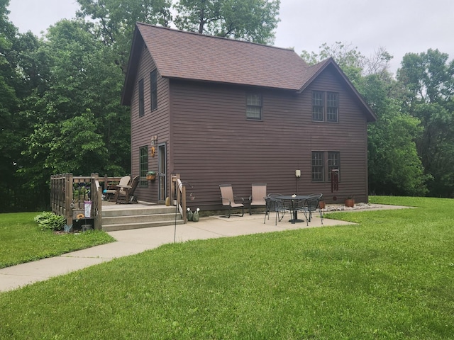 23064 Pearl Lake Rd, Lake View Twp, MN 56501 - back of house with a deck, a yard, roof with shingles, and a patio area