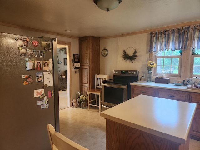 23064 Pearl Lake Rd, Lake View Twp, MN 56501 - kitchen featuring stainless steel appliances, light floors, a center island, light countertops, and brown cabinets