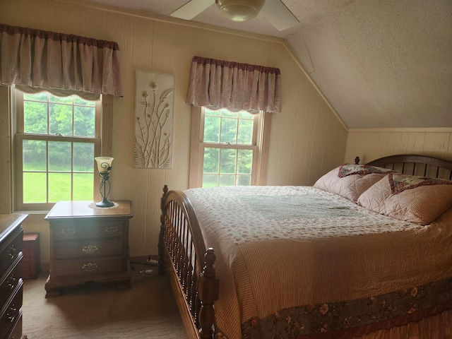 23064 Pearl Lake Rd, Lake View Twp, MN 56501 - bedroom with lofted ceiling, multiple windows, carpet, a ceiling fan, and wooden walls