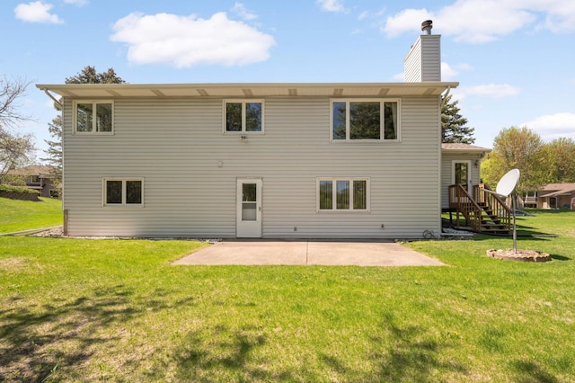 3924 Denmark Ave, Eagan, MN 55123 - rear view of property with a chimney, a yard, and a patio area