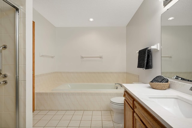 3924 Denmark Ave, Eagan, MN 55123 - full bathroom featuring tile patterned floors, toilet, a bath, vanity, and a stall shower