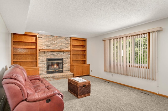 3924 Denmark Ave, Eagan, MN 55123 - living area featuring baseboards, a textured ceiling, carpet, built in features, and a fireplace