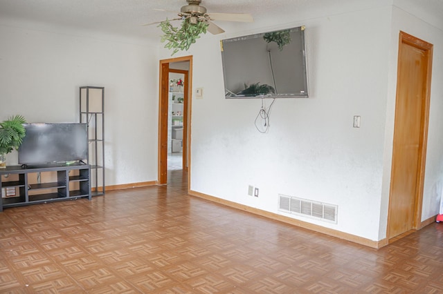 2161 Ross Ave E, Saint Paul, MN 55119 - unfurnished living room featuring a ceiling fan and baseboards
