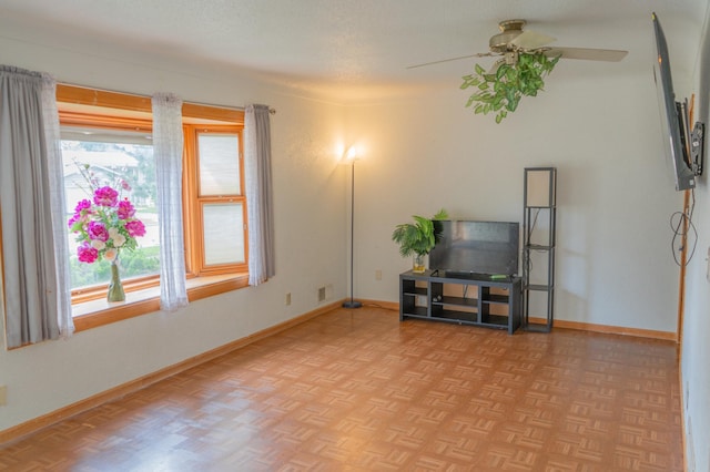 2161 Ross Ave E, Saint Paul, MN 55119 - living area with baseboards and a ceiling fan