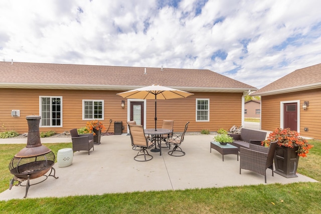 1614 8th St, Grand Rapids, MN 55744 - view of patio featuring an outdoor living space with a fire pit