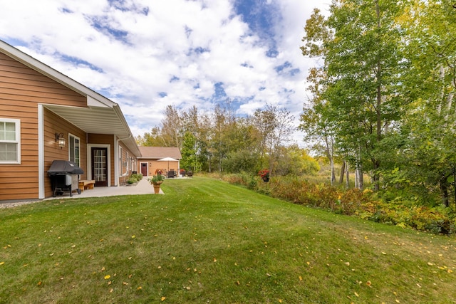 1614 8th St, Grand Rapids, MN 55744 - view of green lawn featuring a patio