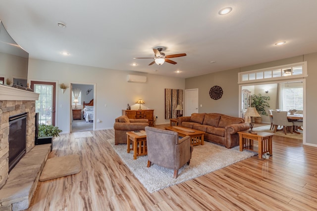 1614 8th St, Grand Rapids, MN 55744 - living room with a wall mounted air conditioner, light wood-type flooring, healthy amount of natural light, and recessed lighting