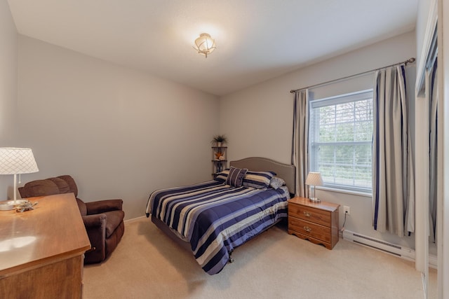 1614 8th St, Grand Rapids, MN 55744 - bedroom with baseboard heating, light carpet, and baseboards