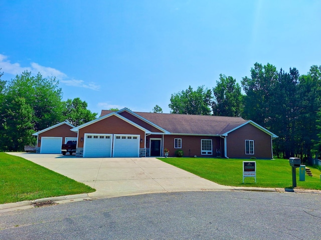 1614 8th St, Grand Rapids, MN 55744 - single story home featuring a front yard, an attached garage, driveway, and stone siding