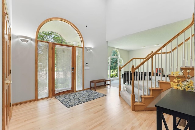 18715 24th Ave N, Plymouth, MN 55447 - foyer entrance with stairway, wood finished floors, and a high ceiling