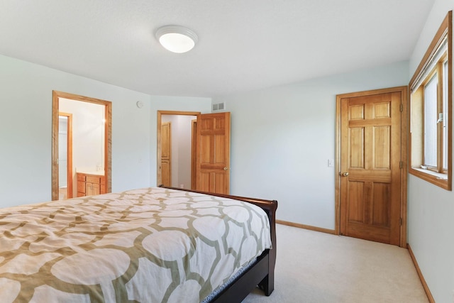 18715 24th Ave N, Plymouth, MN 55447 - carpeted bedroom with baseboards and ensuite bathroom
